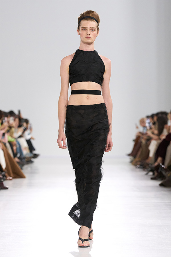 Max Mara Spring/Summer 2026 Fashion Show - Look with Sleeveless Top and black Skirt.